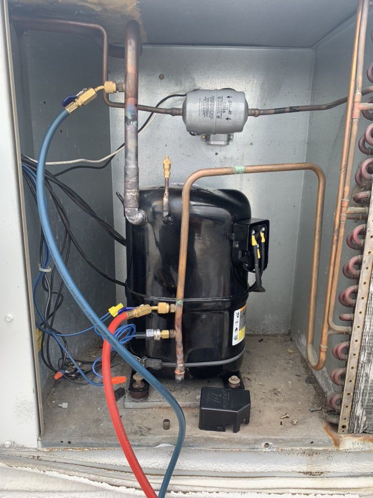 A replacement compressor with new copper piping and filter drier installed by Temperature Select Air.