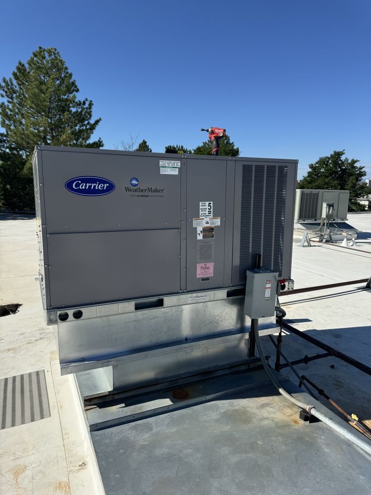 A Carrier WeatherMaker packaged rooftop unit installed on a commercial roof by Temperature Select Air.