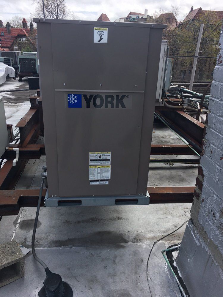 A York packaged HVAC unit installed on an urban rooftop by Temperature Select Air.