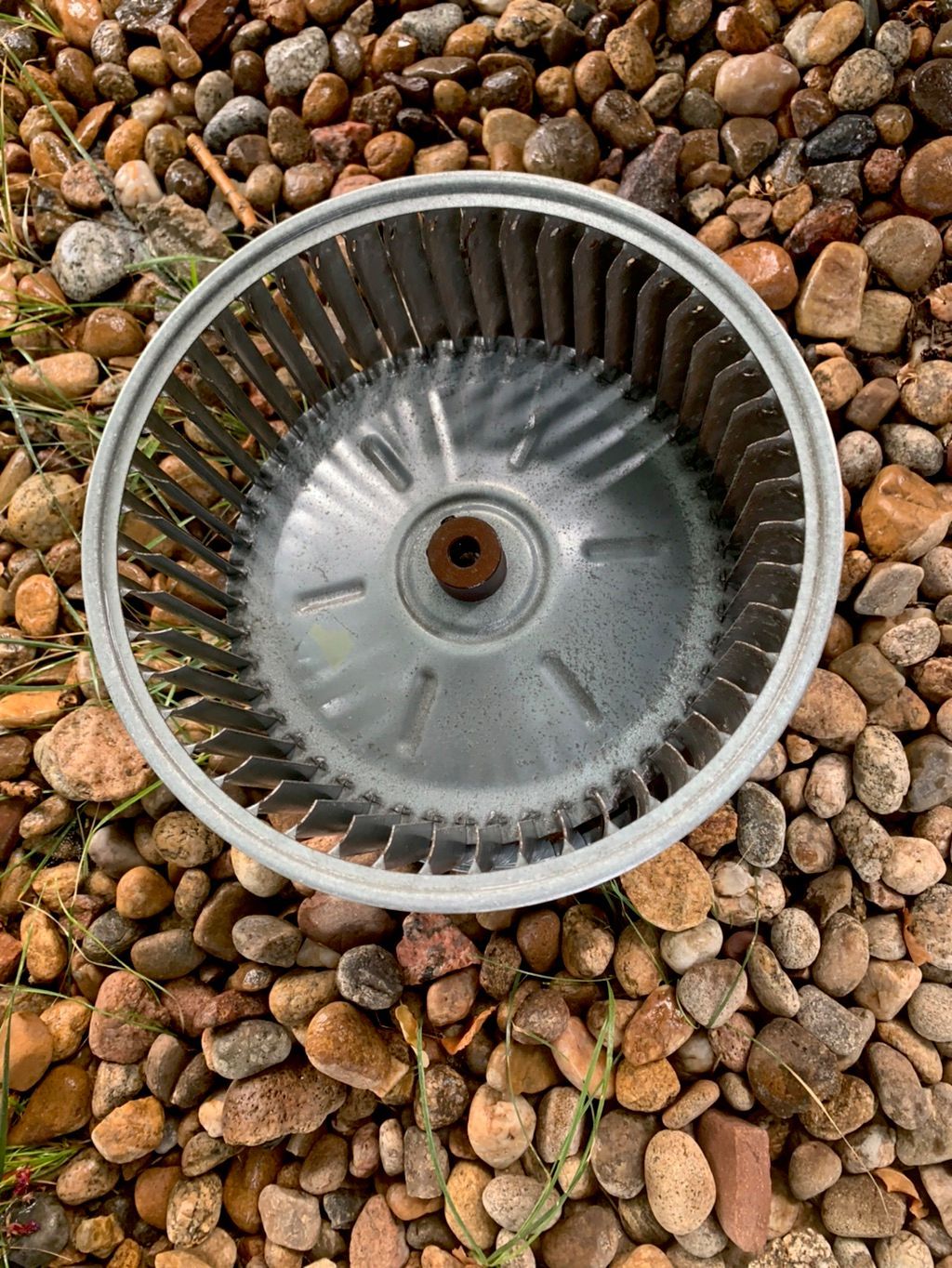 A furnace blower wheel after deep cleaning by Temperature Select Air.
