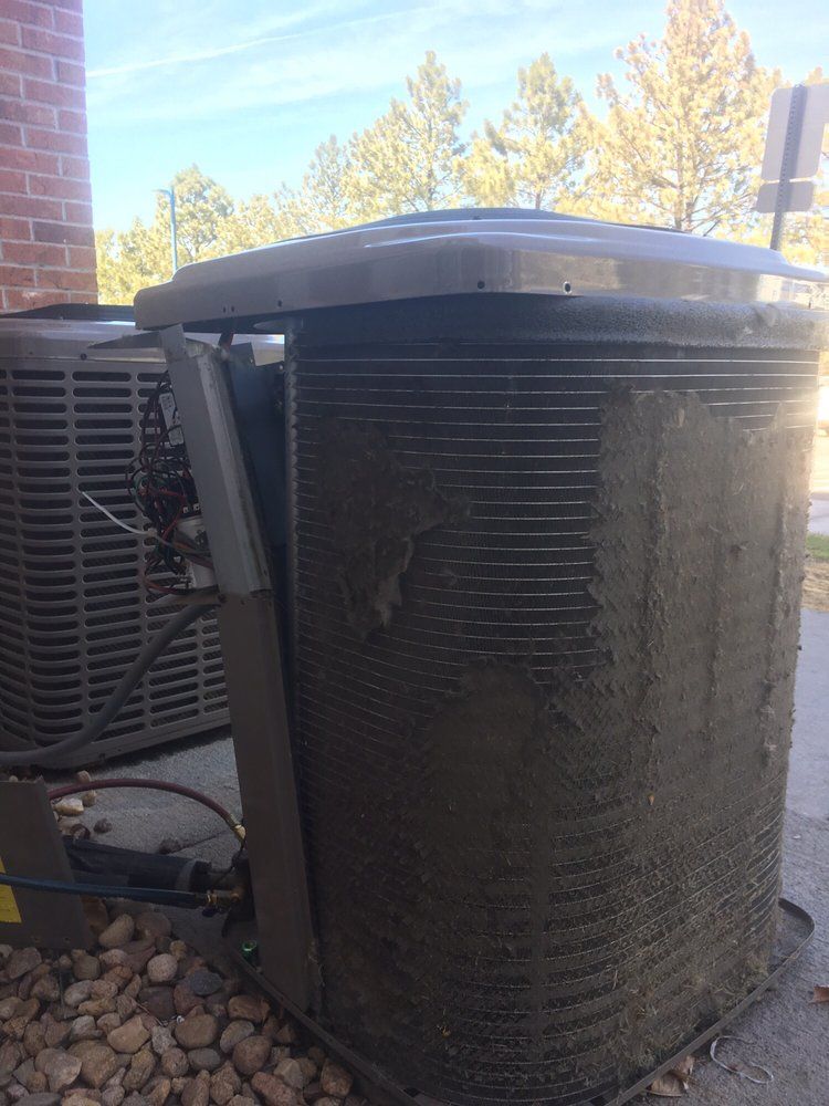 A heavily clogged condenser coil documented before cleaning by Temperature Select Air.