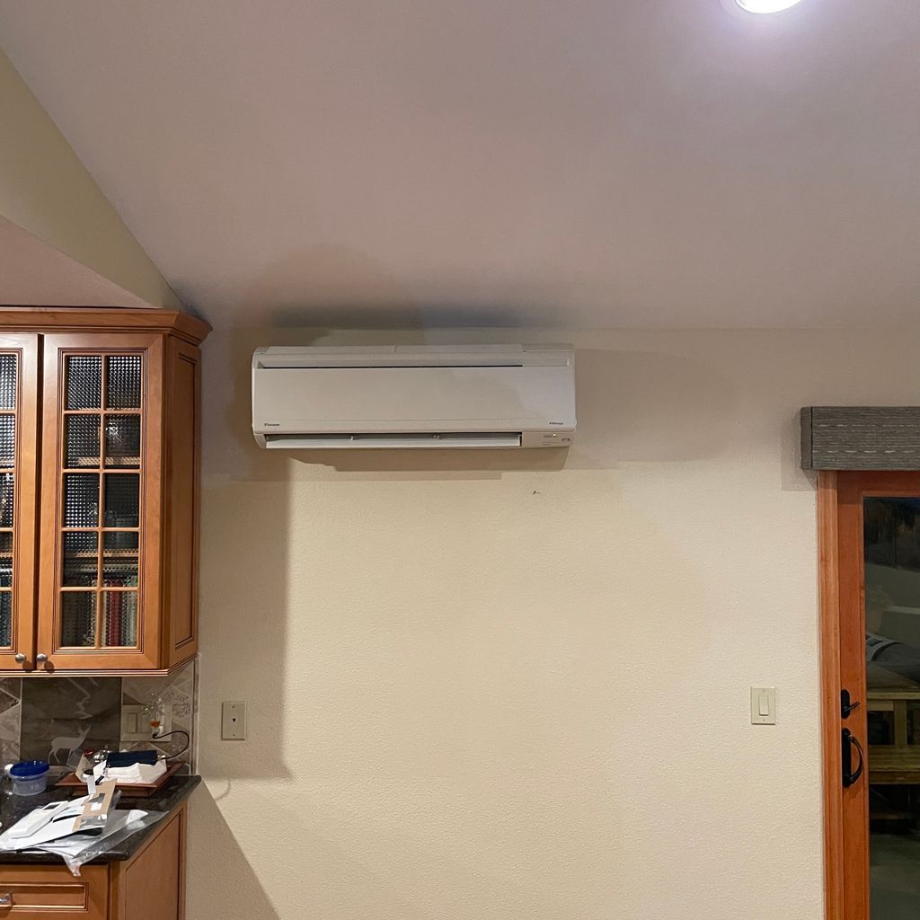 A Daikin wall-mounted ductless mini split head installed in a kitchen by Temperature Select Air.